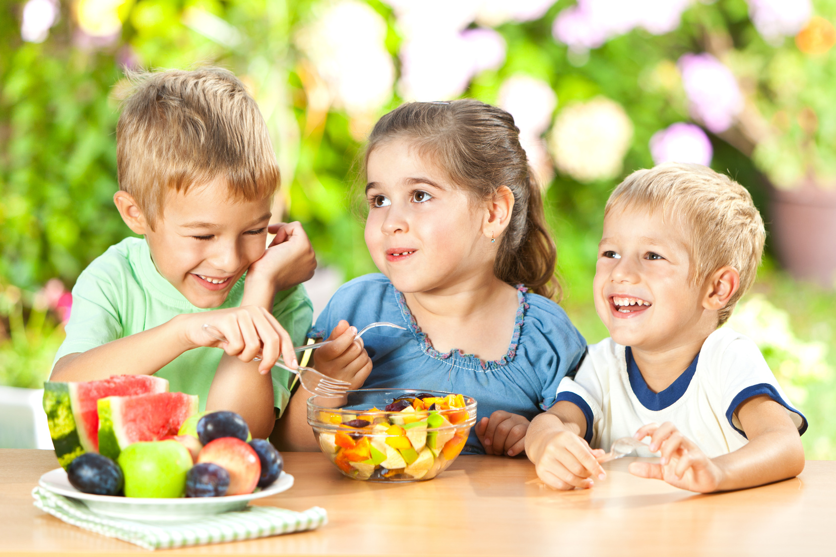Children Eating Healthy Snack Outdoors